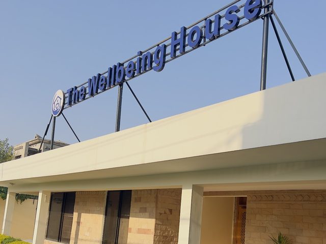 The Wellbeing House exterior signage and entrance